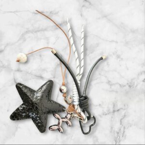 Sleutelhanger  Zwarte Ster- met karakter